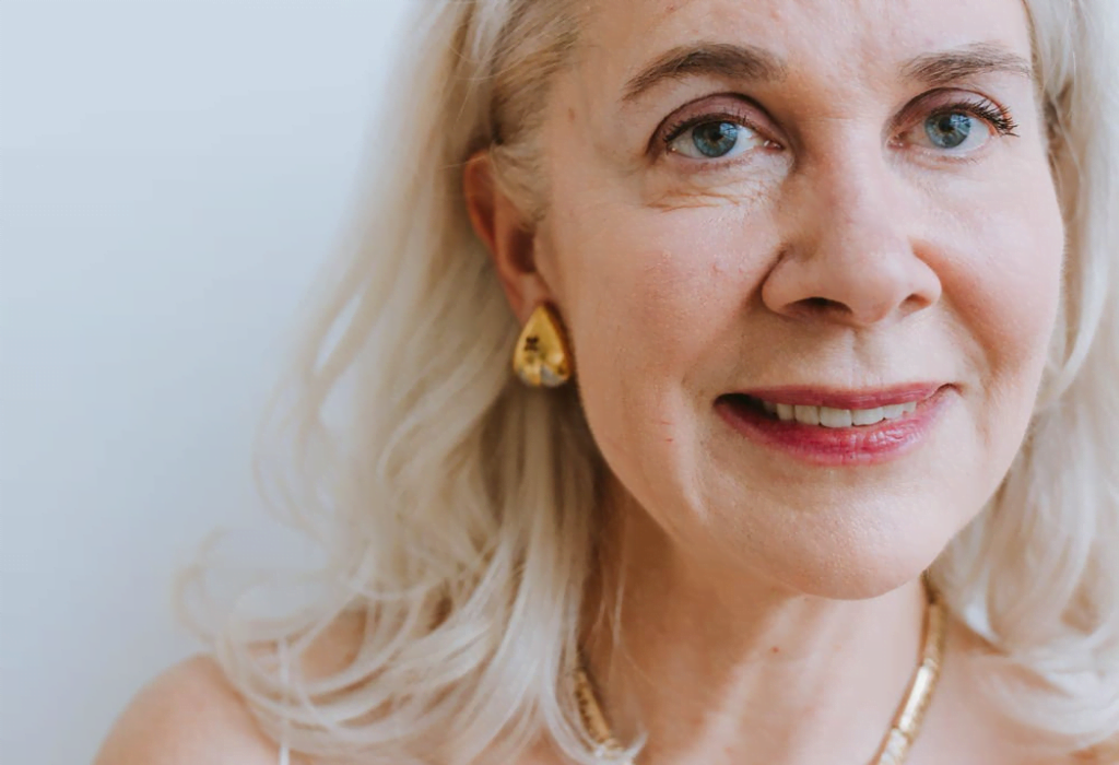 An older woman about to have Cosmetic Acupuncture for wrinkles and anti-aging.